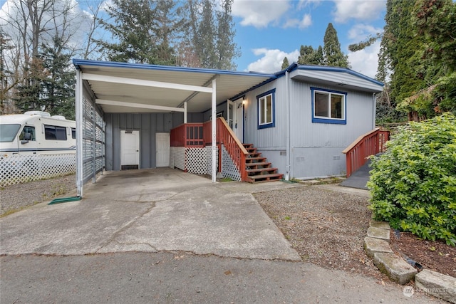 manufactured / mobile home featuring a carport