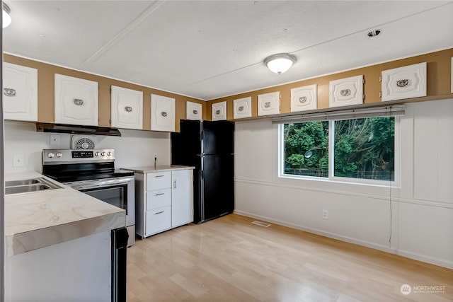 kitchen featuring black fridge, sink, electric range, light hardwood / wood-style floors, and white cabinetry