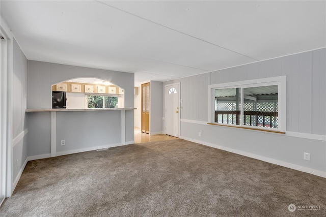 unfurnished room featuring carpet flooring