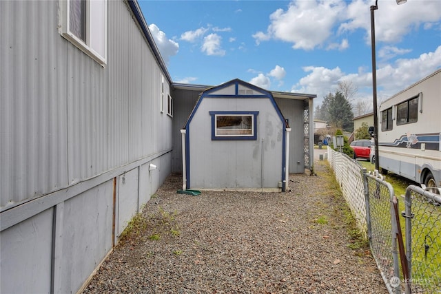 view of home's exterior with a shed