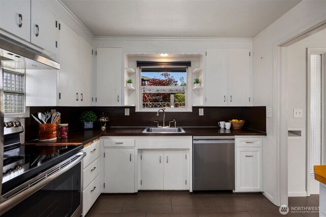 kitchen featuring open shelves, dark countertops, a sink, stainless steel appliances, and backsplash