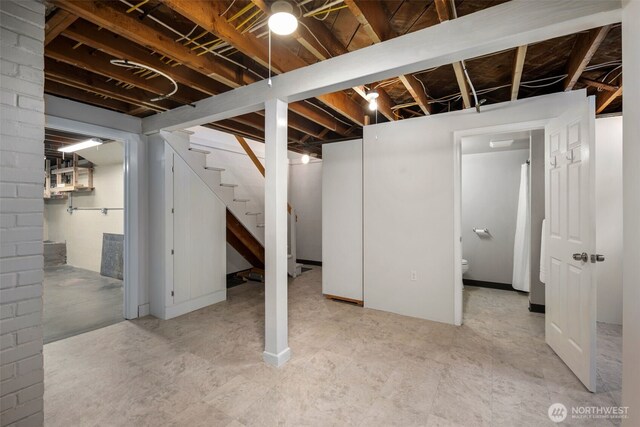 finished basement featuring stairway