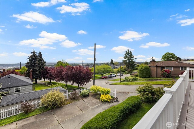 view of property's community with fence and a residential view