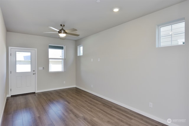 entrance foyer featuring ceiling fan and dark hardwood / wood-style flooring