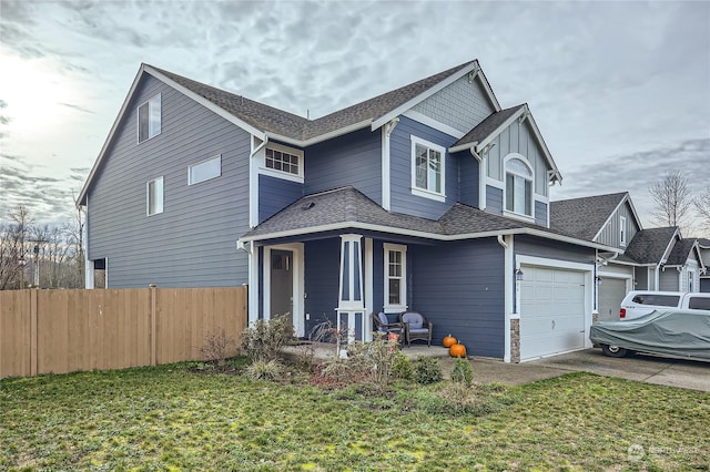 view of front facade featuring a front lawn and a garage