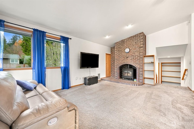 living room featuring a wood stove, carpet floors, and vaulted ceiling