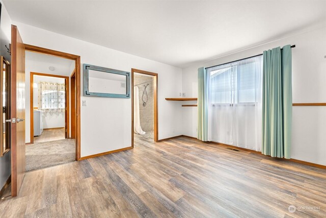 unfurnished room featuring hardwood / wood-style floors