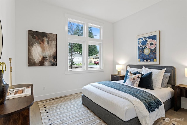 bedroom with light hardwood / wood-style flooring