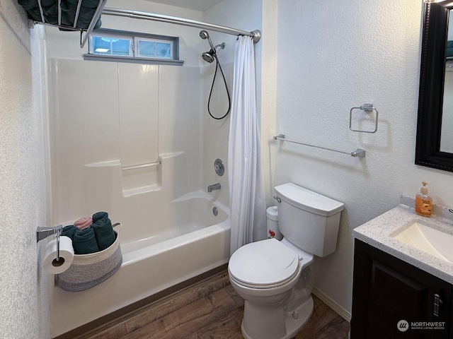 full bathroom with hardwood / wood-style flooring, vanity, toilet, and shower / bath combo with shower curtain