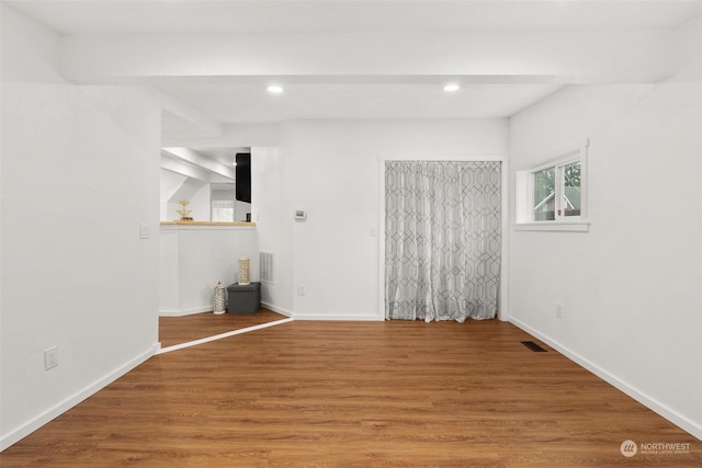 empty room featuring hardwood / wood-style flooring