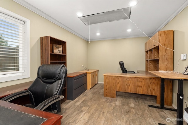 home office with hardwood / wood-style floors and ornamental molding