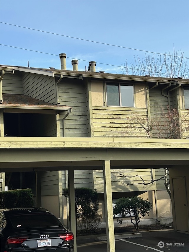 view of side of home featuring a carport