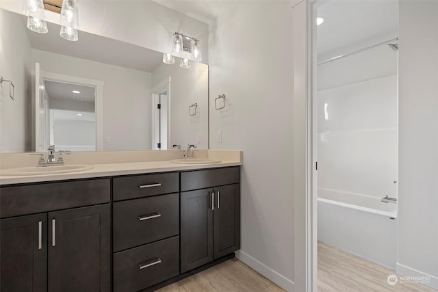 bathroom featuring wood-type flooring and vanity