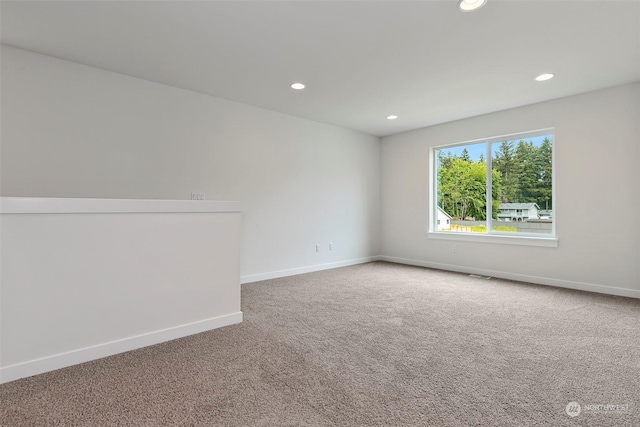 unfurnished room featuring carpet flooring