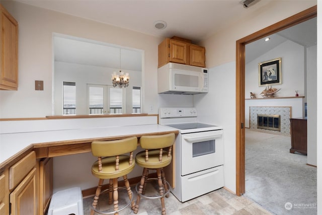 kitchen featuring white appliances, light colored carpet, an inviting chandelier, hanging light fixtures, and lofted ceiling