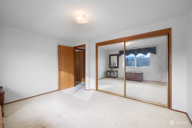 306 E Front St Unit 2, Port Angeles, WA 98362 - unfurnished bedroom with a closet, carpet floors, and baseboards