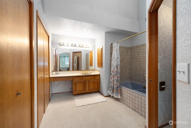 bathroom featuring vanity, shower / bath combination with curtain, and a textured ceiling