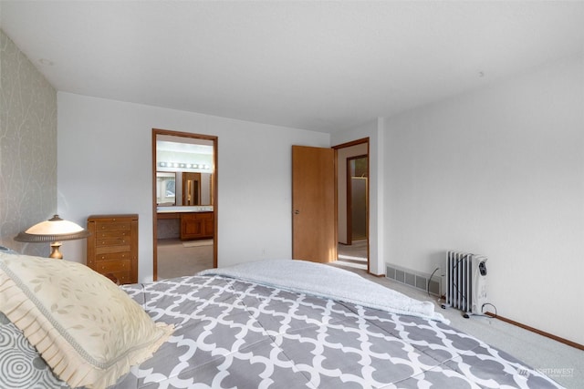 306 E Front St Unit 2, Port Angeles, WA 98362 - carpeted bedroom with wallpapered walls, radiator, baseboards, and ensuite bath