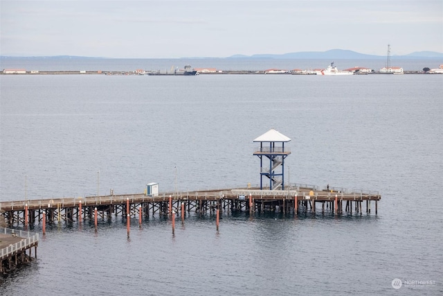 view of dock featuring a water and mountain view