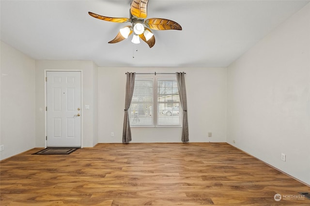 unfurnished room with ceiling fan and light hardwood / wood-style floors