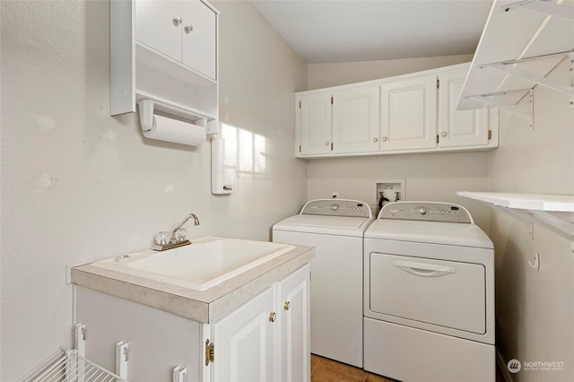 washroom featuring washer and dryer, light tile patterned floors, cabinets, and sink