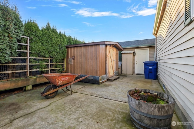 view of patio / terrace featuring a shed