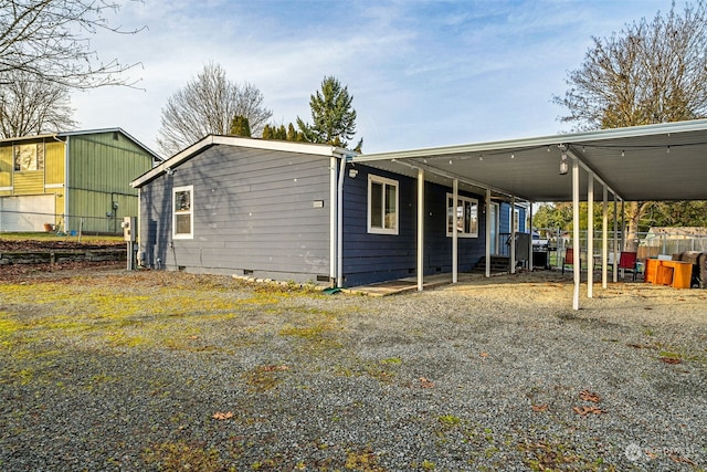 exterior space with a carport