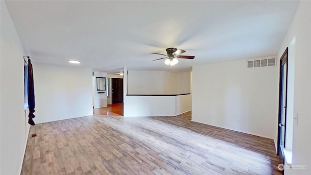 unfurnished room featuring light hardwood / wood-style flooring and ceiling fan