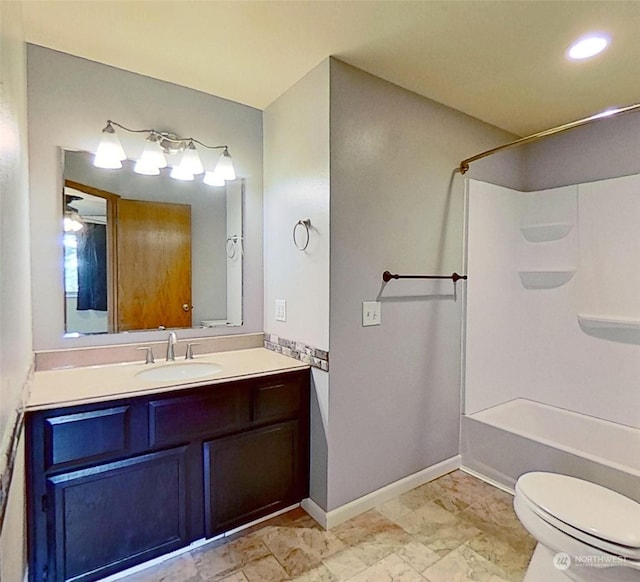 full bathroom with toilet, vanity, and shower / washtub combination