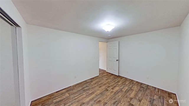 interior space featuring hardwood / wood-style flooring and a closet