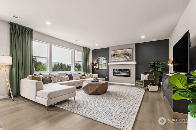 living room with light hardwood / wood-style flooring