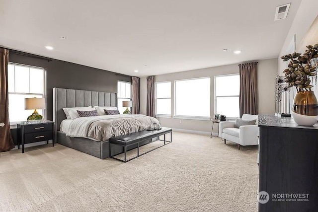 bedroom with light colored carpet