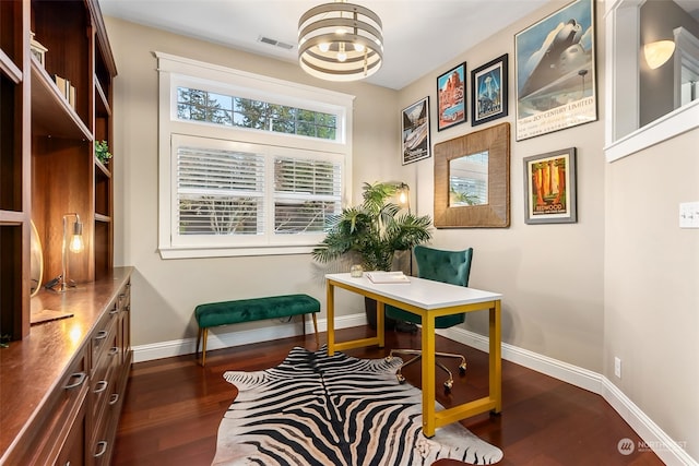 living area with an inviting chandelier and dark wood-type flooring