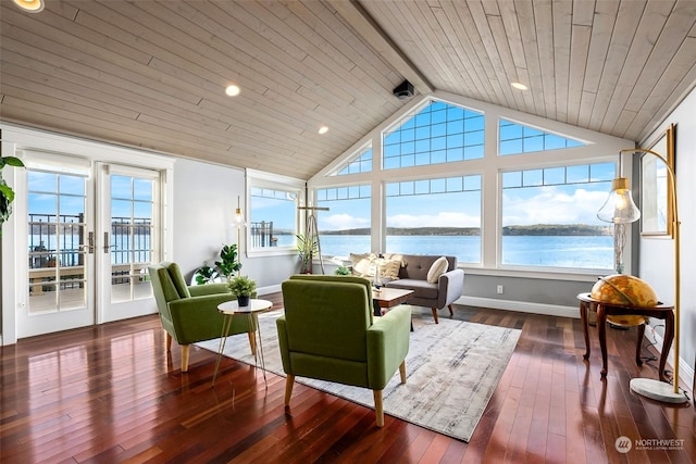 sunroom / solarium featuring french doors, vaulted ceiling with beams, a water view, and a healthy amount of sunlight