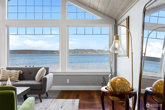 sunroom featuring plenty of natural light, a water view, lofted ceiling, and wood ceiling