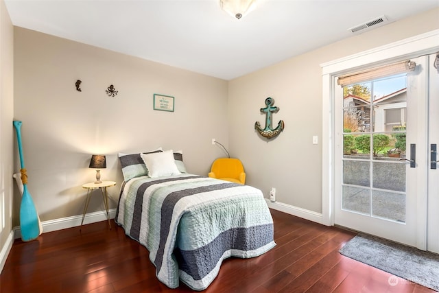 bedroom with dark wood-type flooring