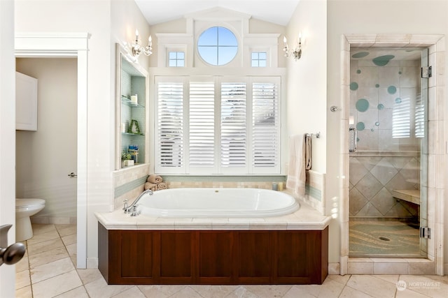 bathroom featuring vaulted ceiling, a wealth of natural light, and independent shower and bath