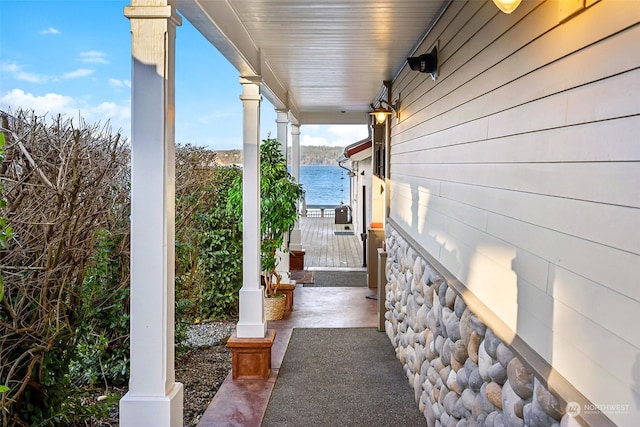 view of patio with a water view