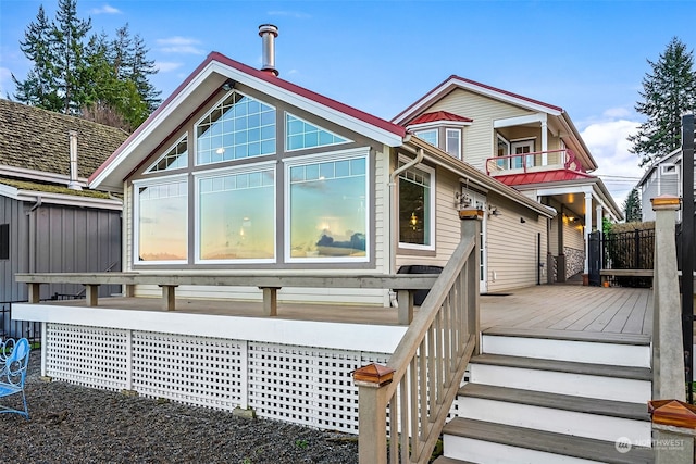 rear view of property with a deck