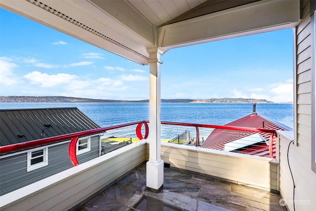 balcony featuring a water view