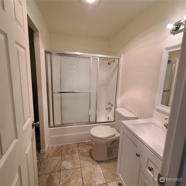 full bathroom with toilet, vanity, and combined bath / shower with glass door