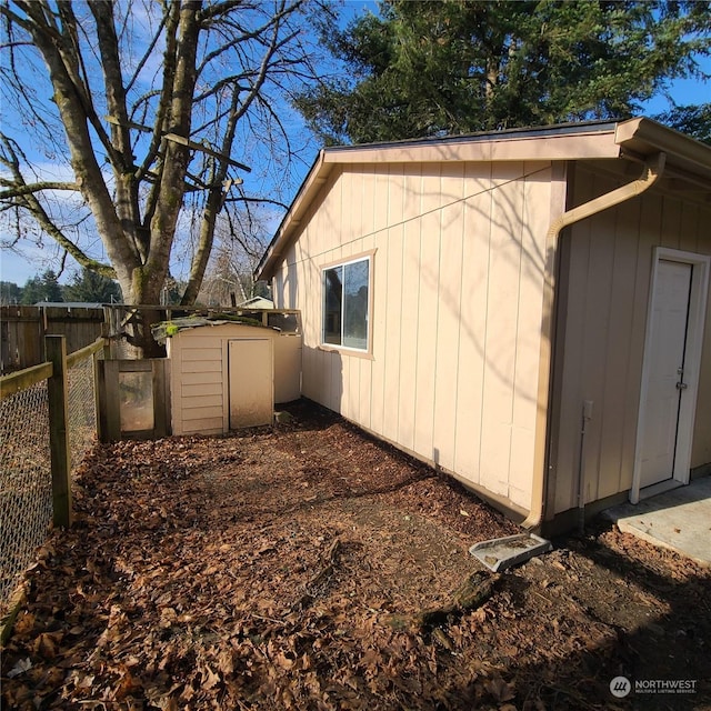 view of property exterior featuring a storage unit