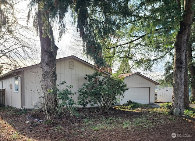 view of side of home with an outbuilding