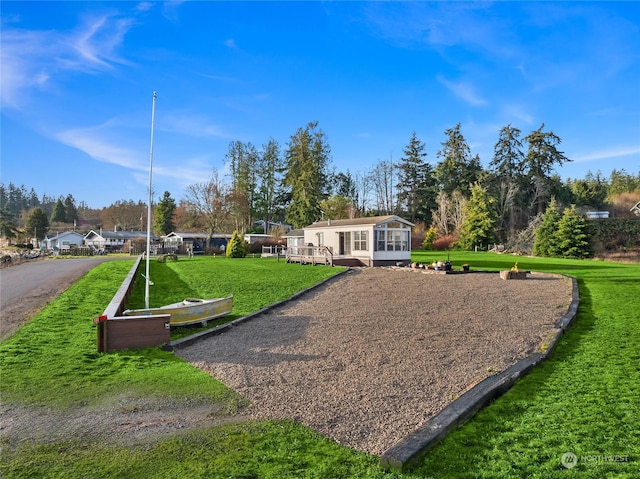 view of community featuring a lawn