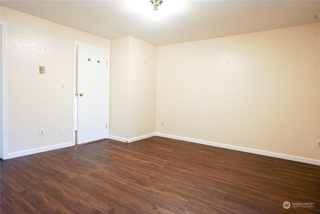 unfurnished room featuring dark hardwood / wood-style floors