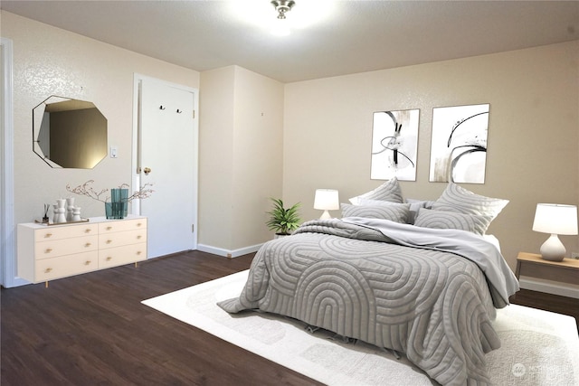 bedroom featuring dark hardwood / wood-style floors