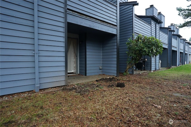 view of side of property featuring a balcony