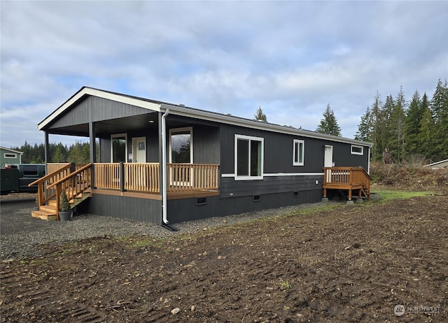 25 Newton Rd, Forks, WA 98331 - view of front of house featuring crawl space and a porch