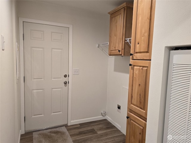 laundry room featuring cabinets, dark wood-type flooring, and hookup for an electric dryer