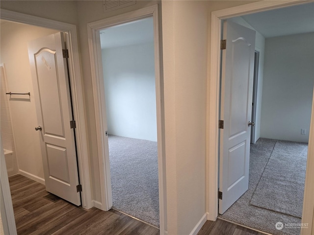 hall featuring dark wood-type flooring